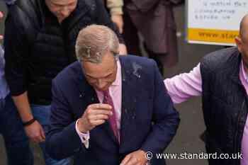 Woman arrested after Nigel Farage doused with milkshake outside pub