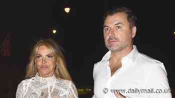 Lizzie Cundy stuns in a semi-sheer lace dress as she enjoys dinner with a male pal in Mayfair