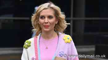 Rachel Riley puts on a leggy display in a pair of blue denim shorts and a colourful crochet knit cardigan as she steps out in Manchester