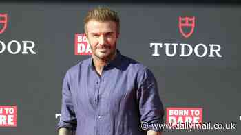 David Beckham poses for selfies with a mob of adoring fans as he attends watch shop opening in Barcelona