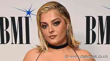 Bebe Rexha sizzles in busty black dress as she leads stars at the BMI Pop Awards in Beverly Hills - after being pelted by objects AGAIN at concert