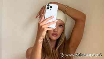 Rosie Huntington-Whiteley goes nude for racy snaps, wearing only a cream satin headscarf and £17k Tiffany & Co. bracelet