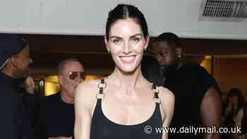 Hilary Rhoda shows off svelte model figure in a black thigh-high split dress as she attends lavish dinner to celebrate Michael Kors' new Rodeo Drive store in LA