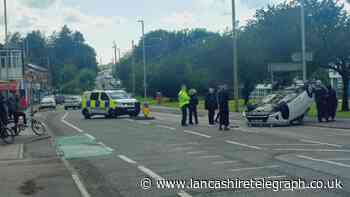 Blackburn road shut after car overturns during crash
