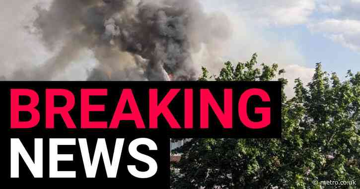 Roof collapses as huge fire tears through east London flats