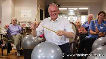 It's Ed Ravey! Lib Dem leader takes to the drums to belt out We Will Rock You in latest bizarre election photo-op