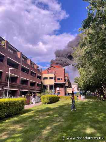 Hackney fire: Residents flee as huge blaze breaks out at block of flats with 100 firefighters battling flames