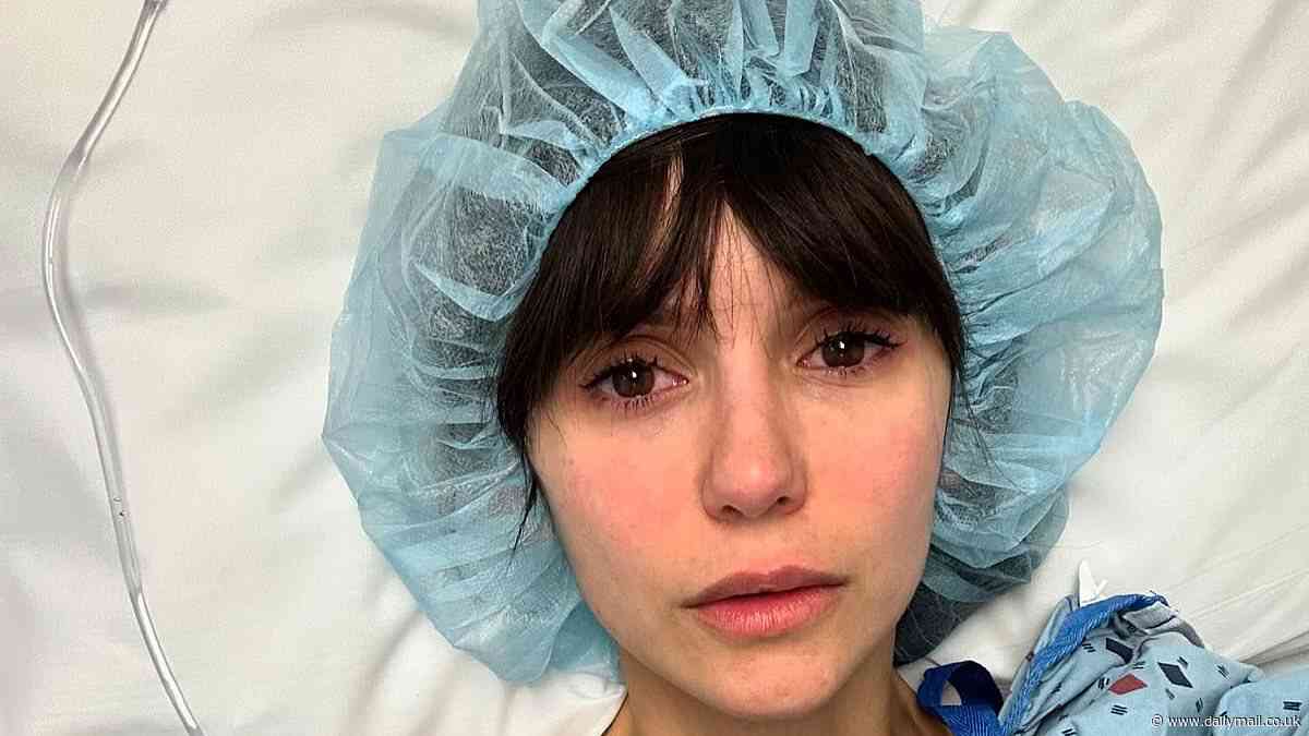 Nina Dobrev reveals her 'surgery was a success' as she flashes a thumbs up from her bed after being hospitalized in the wake of serious e-bike crash