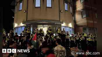 Sixteen arrested after police station protest