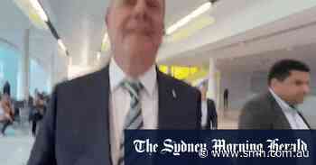 ‘You assaulted me’: Nine chairman Peter Costello appears to shove journalist at airport