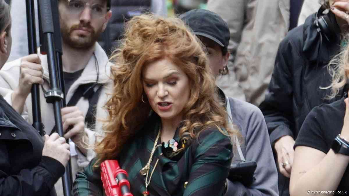Isla Fisher wields a water gun as she joins Renee Zellwegger for filming Bridget Jones: Mad About The Boy after filming was 'thrown into chaos when cast member suffered injury'