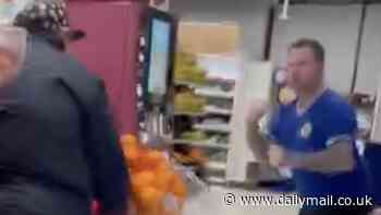 Dramatic moment have-a-go hero customer tries to stop two 'shoplifters' stealing champagne from Sainsbury's
