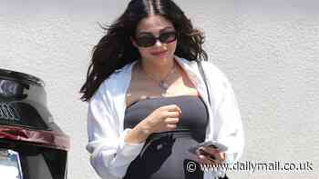 Jenna Dewan covers her baby bump in a skintight black maxi dress as she enjoys lunch date with friends in LA