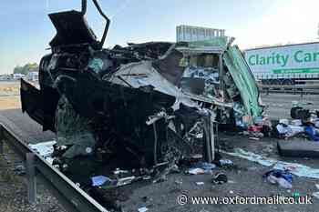 Photographs show aftermath after lorry hit bridge on M40