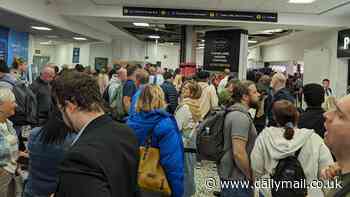 Birmingham Airport passengers face another day of chaos as hundreds of people wait in long queues and doctor 'treats two people for hypothermia'