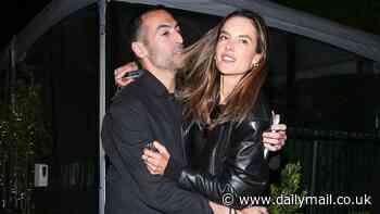 Alessandra Ambrosio embraces film producer Mohammed al-Turki as the pair enjoy dinner date in Santa Monica