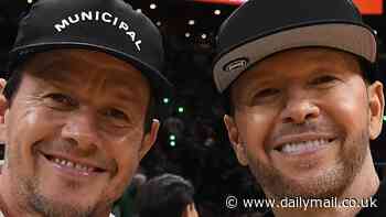 Mark Wahlberg, 53, and his NKOTB brother Donnie, 54, make a rare joint appearance in Boston to watch the Celtics defeat the Dallas Mavericks at NBA Finals