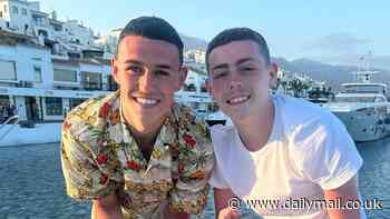 Catch of the day! Phil Foden proves he's a reel winner by landing huge fish on yacht during family holiday in Marbella before he joins up with fellow England stars ahead of Euro 2024