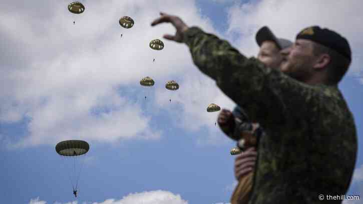 House lawmakers mark D-Day with parachute jump over Normandy