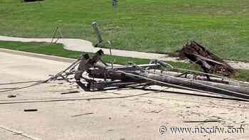 Power pole falls into roadway, damages vehicles