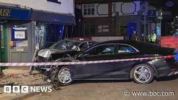 Parked car and building struck in High Street crash