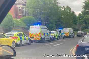 Police cars descend on Bolton street amid ongoing incident
