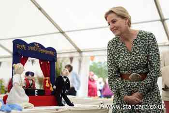 Sophie examines knitted versions of herself at Royal Windsor Flower Show
