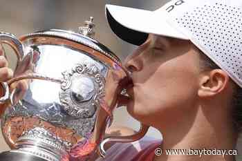 Iga Swiatek wins a third consecutive French Open women's title by overwhelming Jasmine Paolini