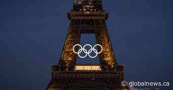 Olympic rings mounted to Eiffel Tower, marking 50 days until Paris games