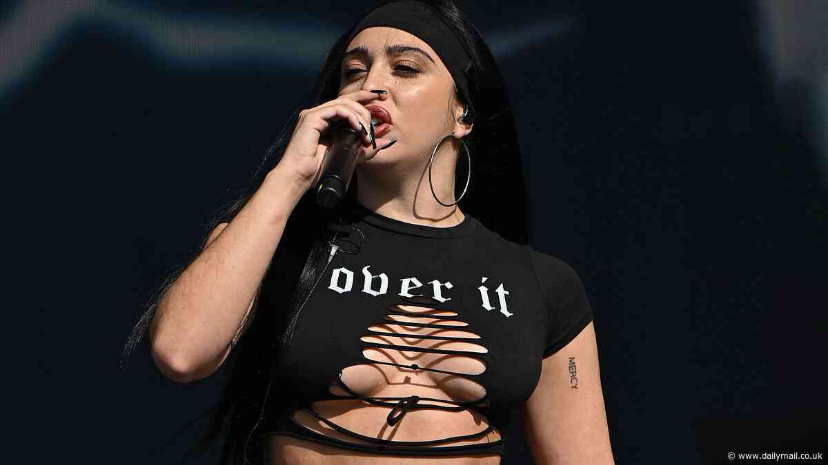 Madonna's daughter Lourdes Leon puts on a busty display and flashes her toned midriff in an edgy ensemble as she performs at Parklife Festival