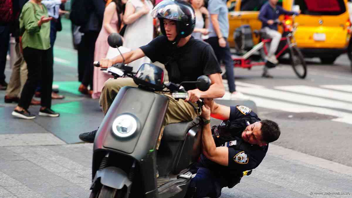Moment NYPD officer tackles a moped driver as part of ongoing crackdown following incidents of scooters being used for crimes around the Big Apple