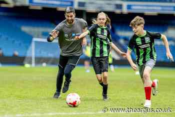 Sussex children play football at Brighton's Amex Stadium