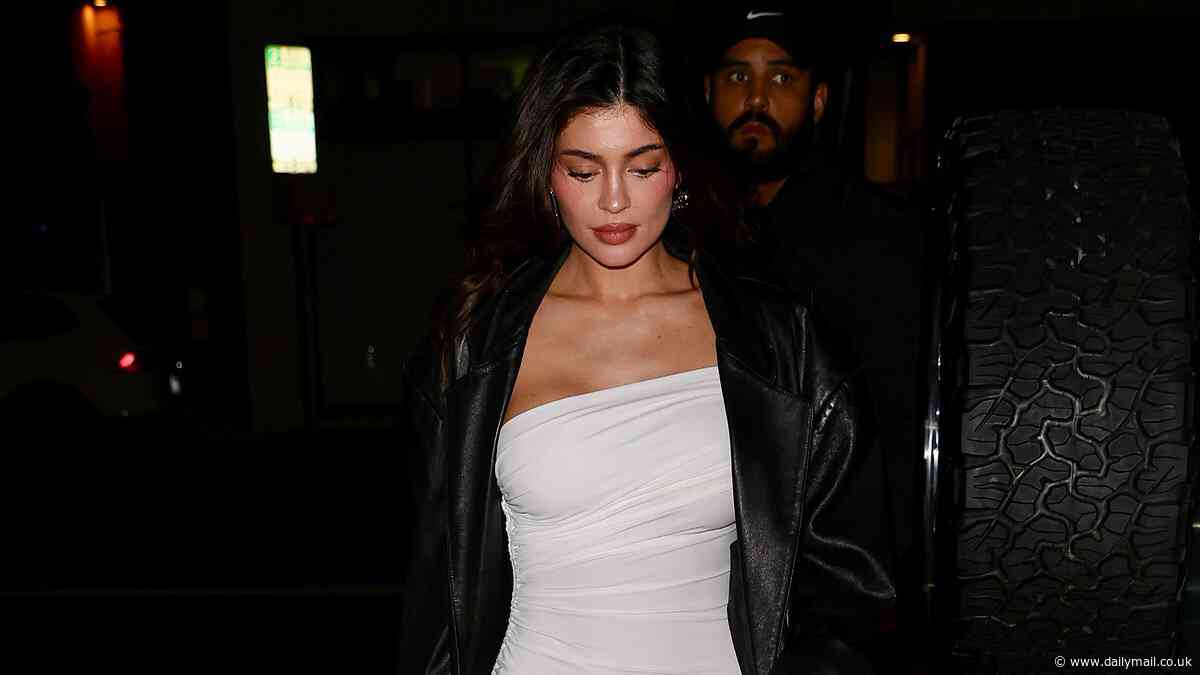 Kylie Jenner puts on a leggy display in a white mini dress while Anastasia Karanikolaou stuns in a dazzling gold number as they enjoy a girls' night out in Los Angeles