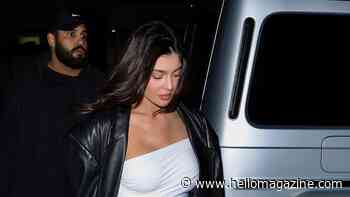 Kylie Jenner wows in skin tight little white dress on a girl's night in LA