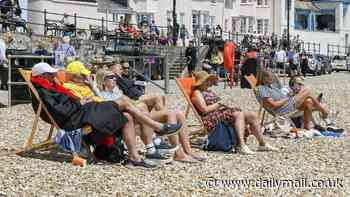 UK weather: British families pack out beaches as country basks in 19C sunshine - before the rain sweeps in TONIGHT