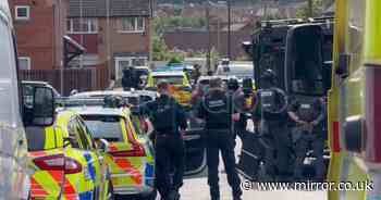 Armed police and bomb squad descend on Leeds road as locals told 'stay indoors'
