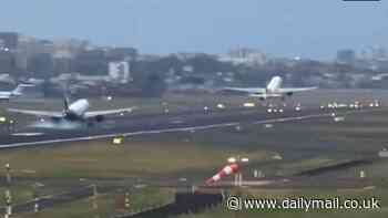 Heart-stopping moment plane lands on runway just feet behind another jet as it takes off from Mumbai airport