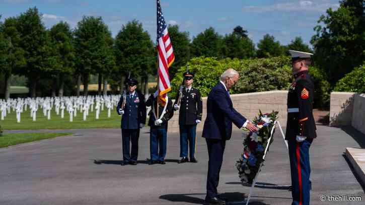 Biden lays wreath in US cemetery in France in trip that served as a rebuke to Trump
