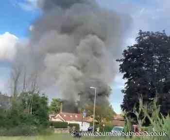 Fire crews from Dorset and Hampshire fight Burton fire