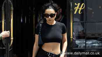 Charli XCX goes braless and flashes her abs in a black crop top as she steps out in New York City after winning rave reviews for new album BRAT