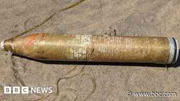 Suspected explosive shell found on beach