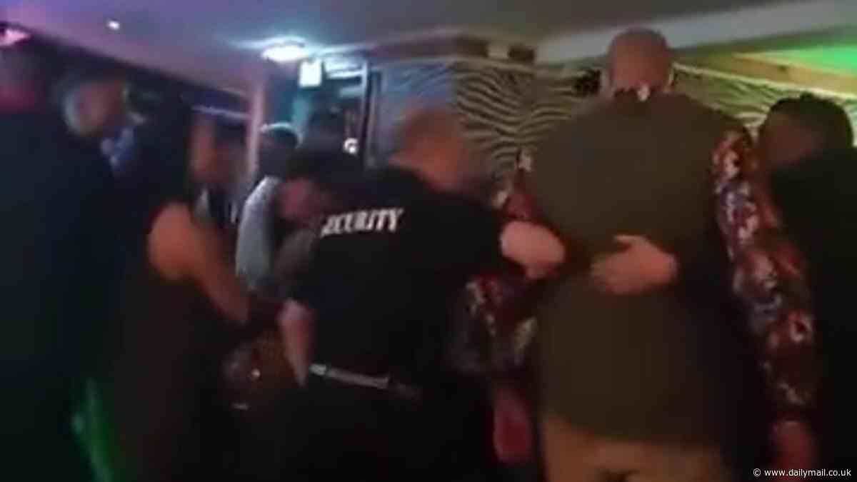 Tyson Fury is escorted from a Morecambe bar in new footage - before collapsing outside - after 'enjoying one drink too many' in the aftermath of first ever defeat