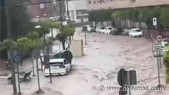 The rain in Spain does not go down the drain! Floods hit Costa Blanca region popular with holidaymakers, with fast-flowing water washing cars along the streets… as Brits prepare to fly out on holiday