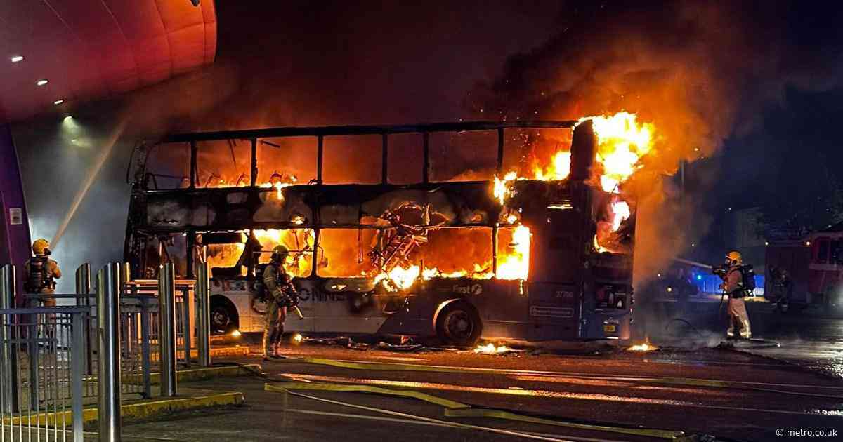 Boy, 14, arrested for arson after double decker bus bursts into flames