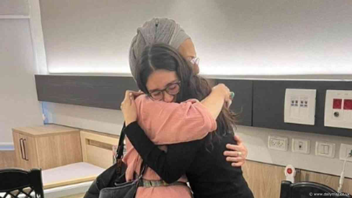 Freed Israeli Noa Argamani hugs the mother of her boyfriend - who is still held hostage by Hamas - as she reveals the news that broke her while she was captive in Gaza