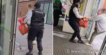 Moment 'shoplifter' and Asda security guard in brutal tug-of-war over shopping bag