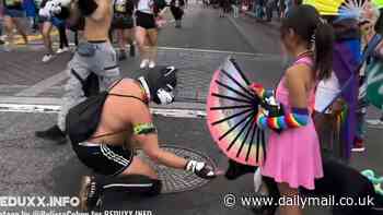 Moment shirtless fetishist in 'pup-play' mask stops to interact with little girl's dog at LA Pride parade