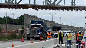 QEW could be closed for hours west of Toronto after dump truck hit overpass
