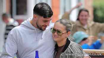 Molly-Mae Hague and her fiancé Tommy Fury put on a loved-up display as they step out together for the first time in three months - after she quashed split rumours