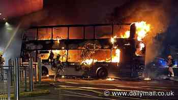 Schoolboys, 13 and 14, are arrested on suspicion of arson after a double-decker burned down at a Burnley bus station